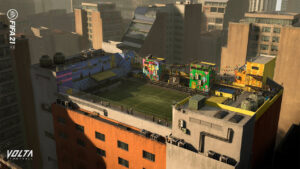 Rooftop football pitch surrounded by colorful buildings in a dense city, shown from an elevated angle.